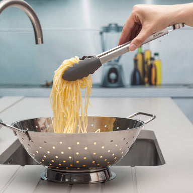 Using a Zeal Silicone Cook’s Tong to drain pasta
