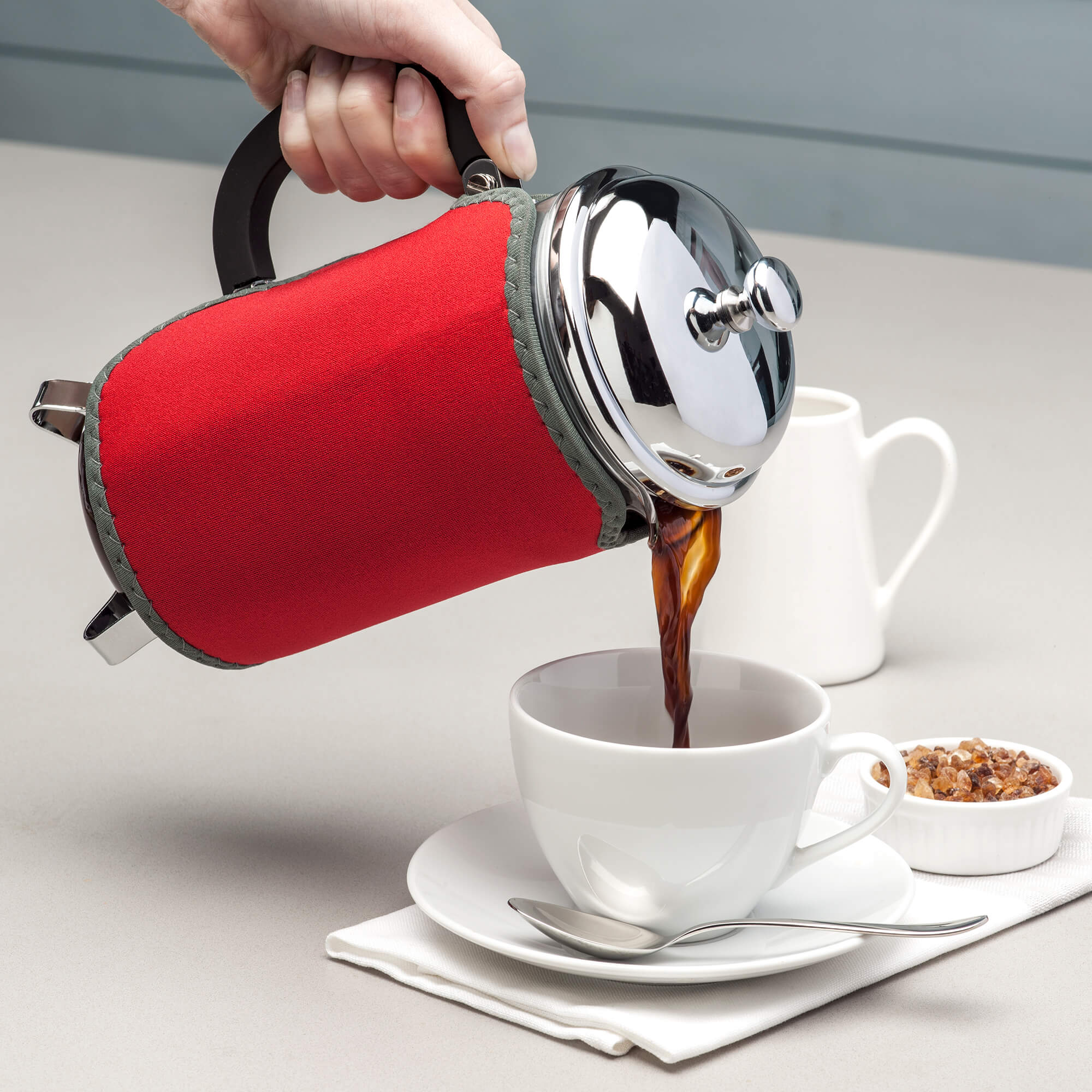 Pouring coffee using the Zeal 8 Cup Cafetiere Jacket