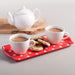 Melamine Dotty Sandwich Tray by Zeal holding tea and biscuits