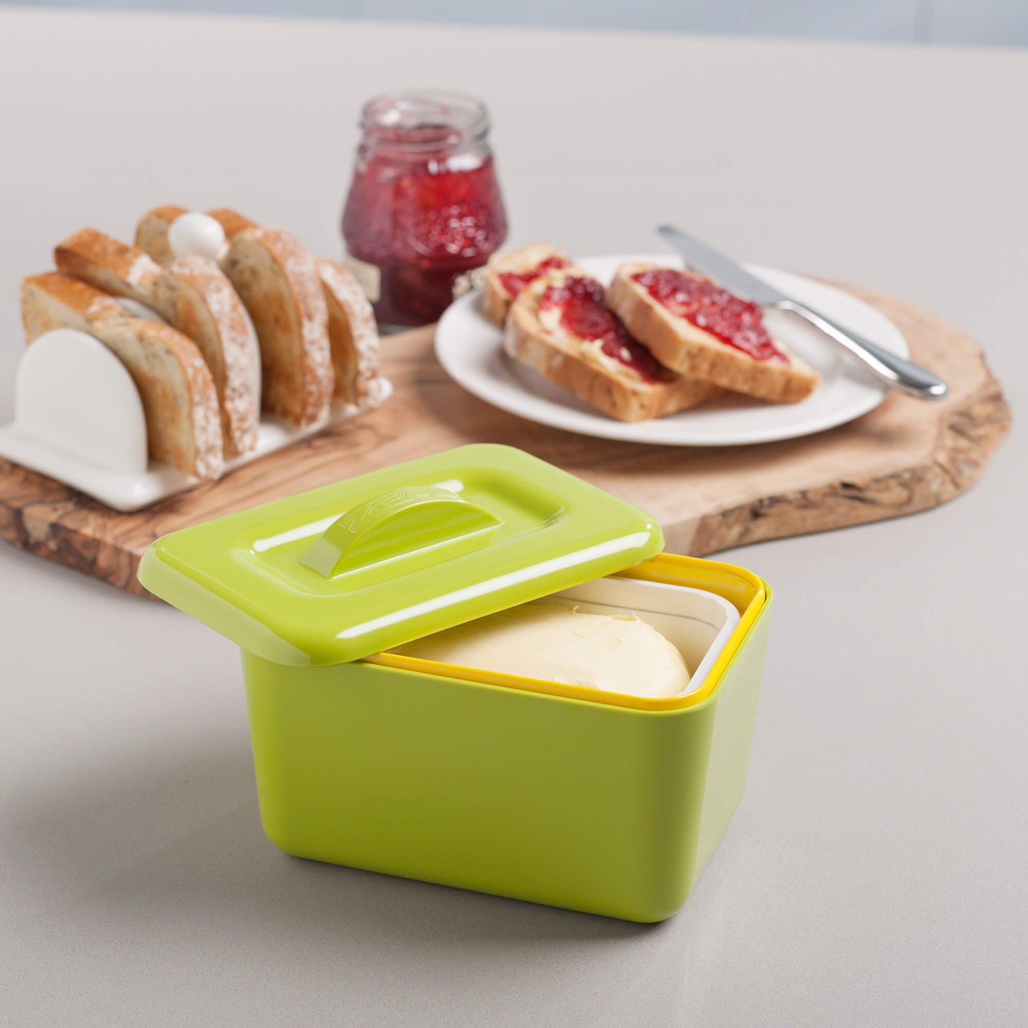 Breakfast table with toast, jam and a Zeal Butter Dish in Lime
