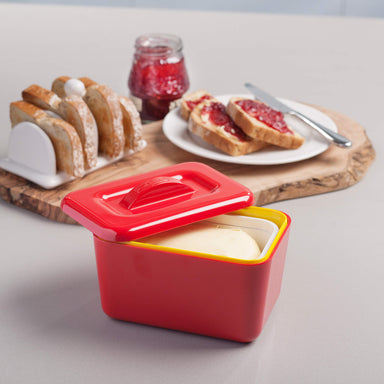 Breakfast table with toast, jam and a Zeal Butter Dish in Red