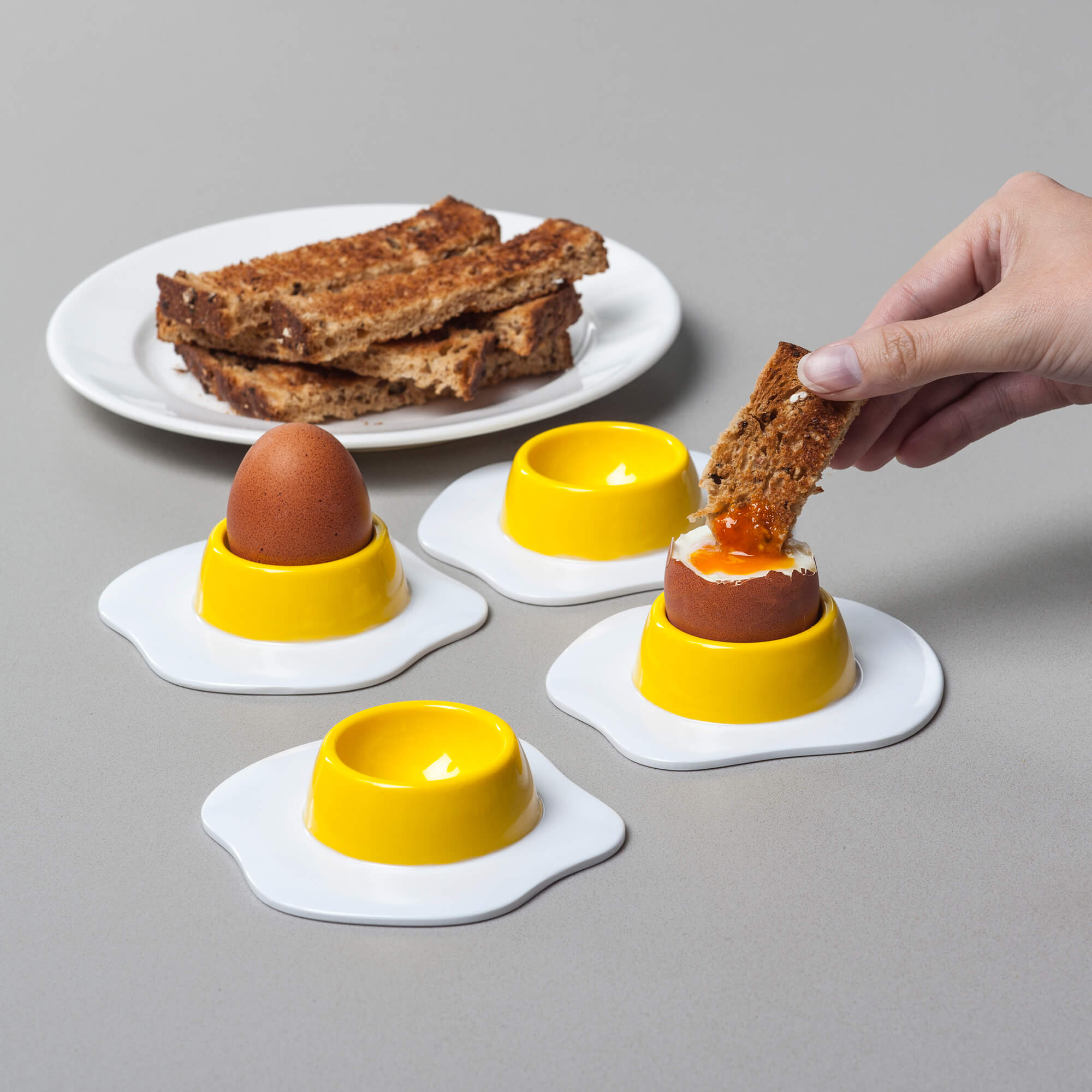 Set of 4 novelty Eggtastic Egg Cups with toast and soldiers