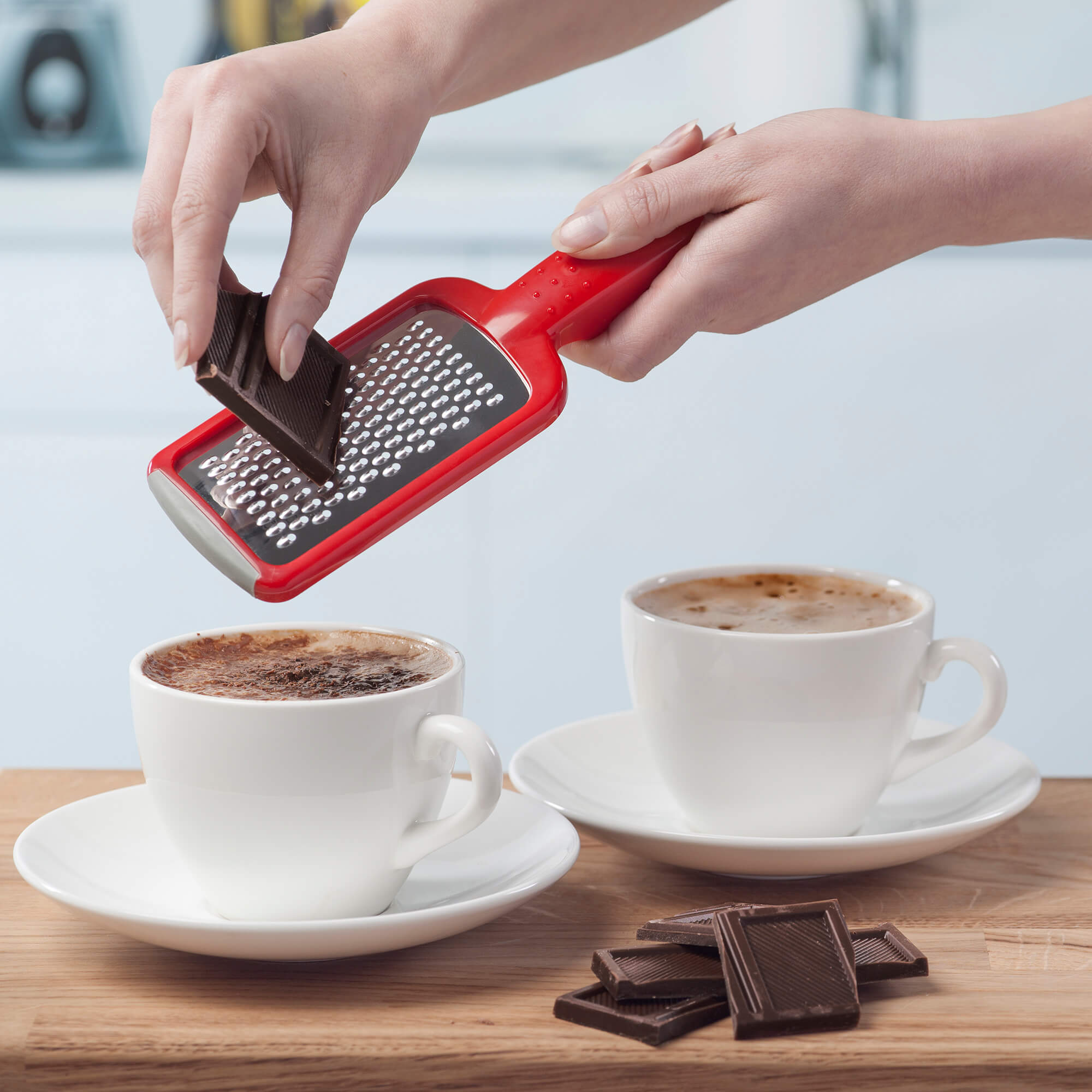 Zeal Mini Fine Grater grating chocolate over cappuccino 