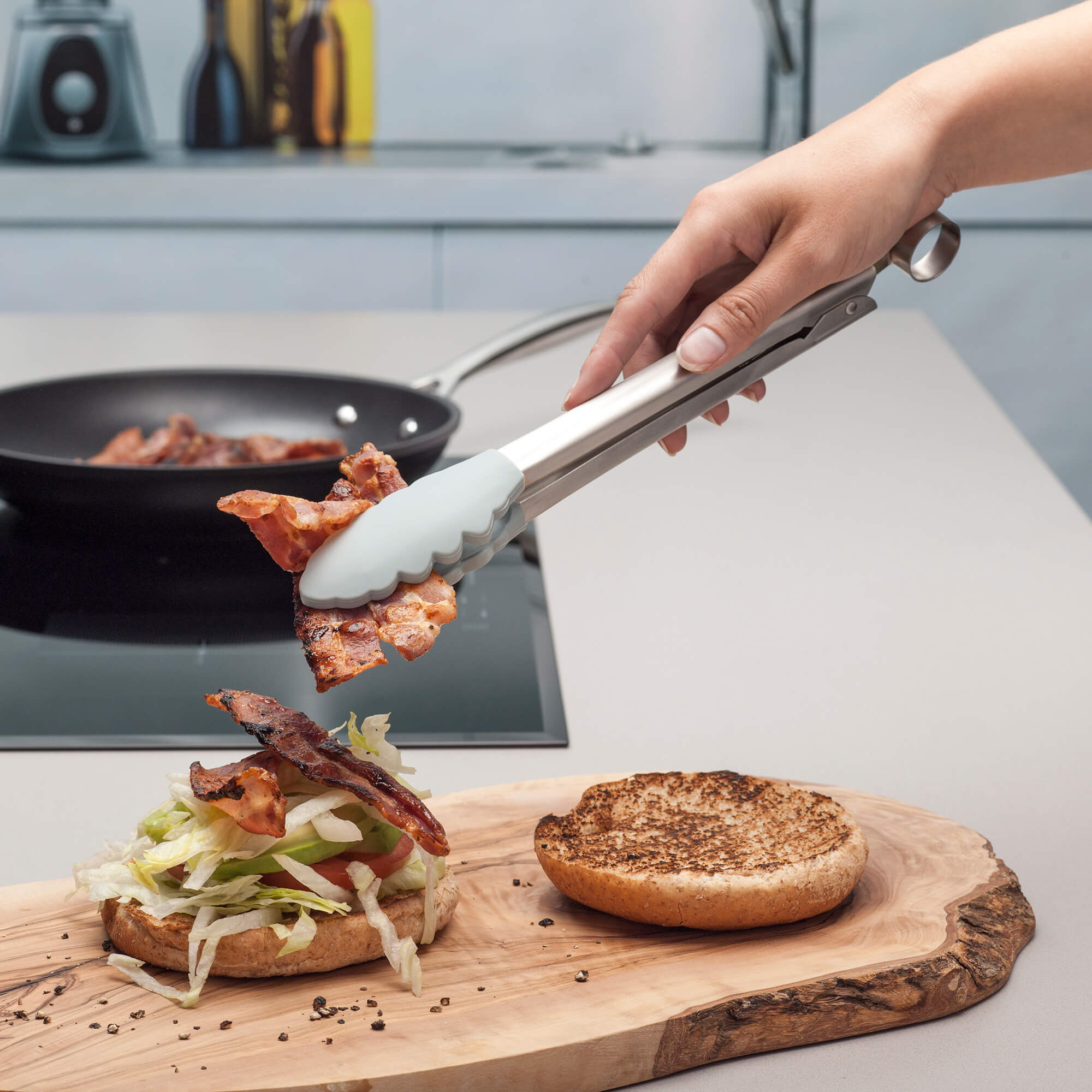 Using a Zeal Silicone Cook’s Tong to serve bacon