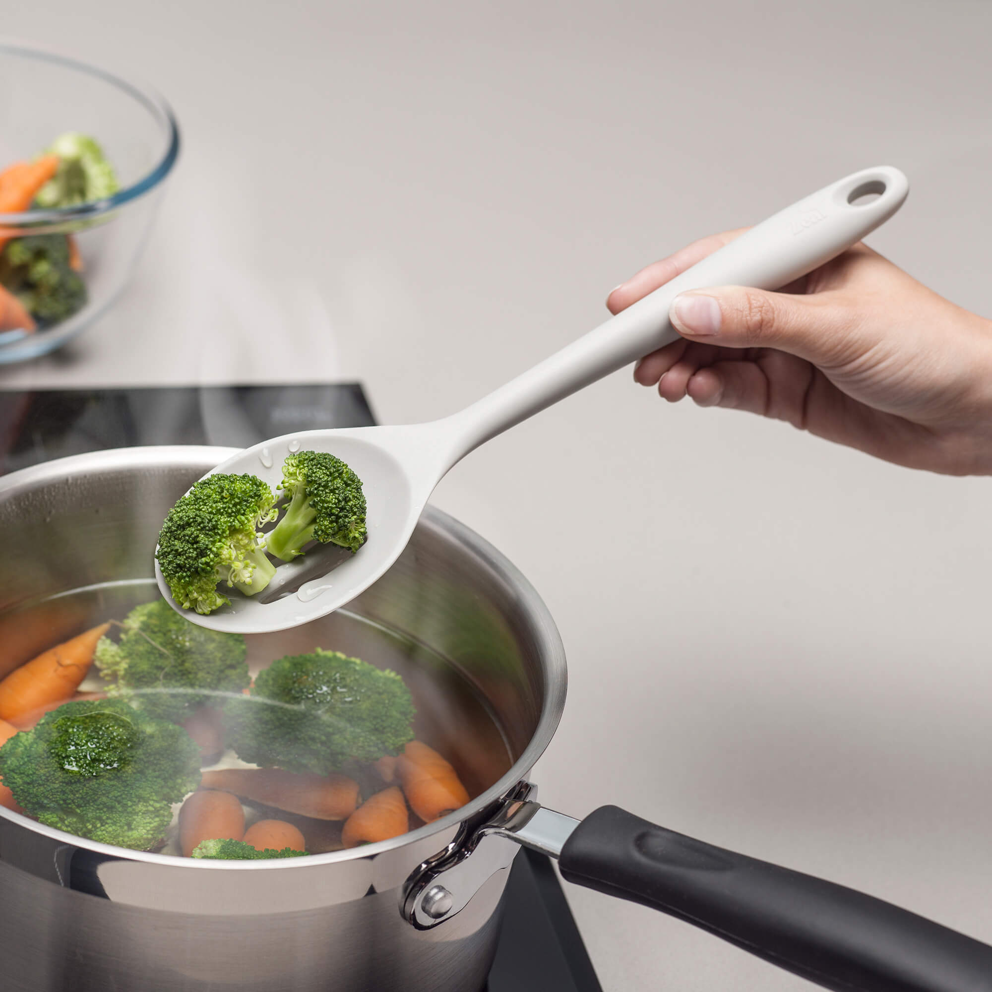Using a Zeal Silicone Slotted Spoon to drain broccoli