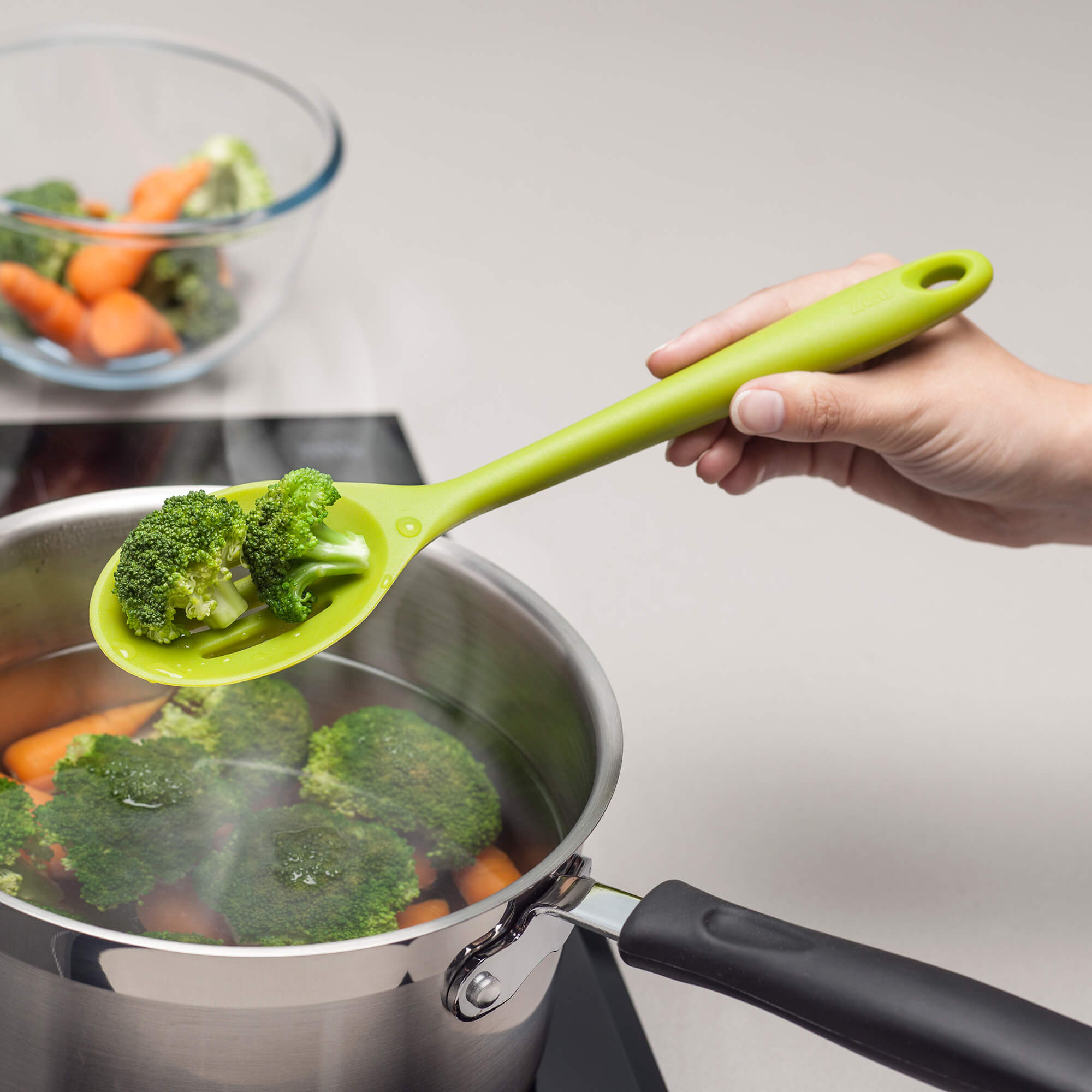 Using a Zeal Silicone Slotted Spoon to drain broccoli