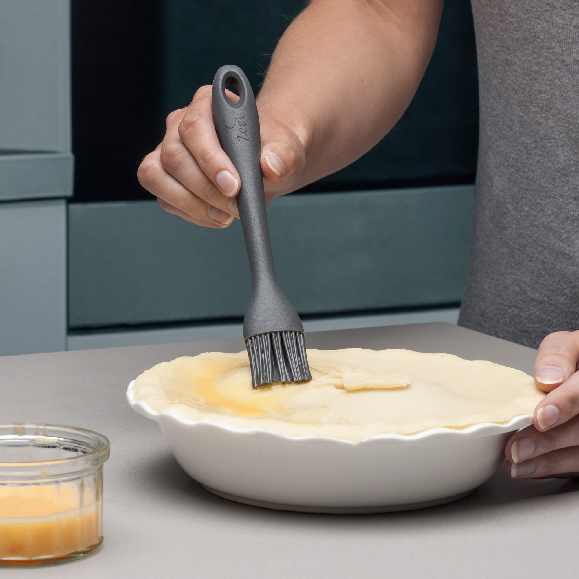 Using a Zeal Silicone Pastry Brush to egg wash a pie lid