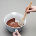 Using a Zeal Silicone Spatula to scrape a bowl