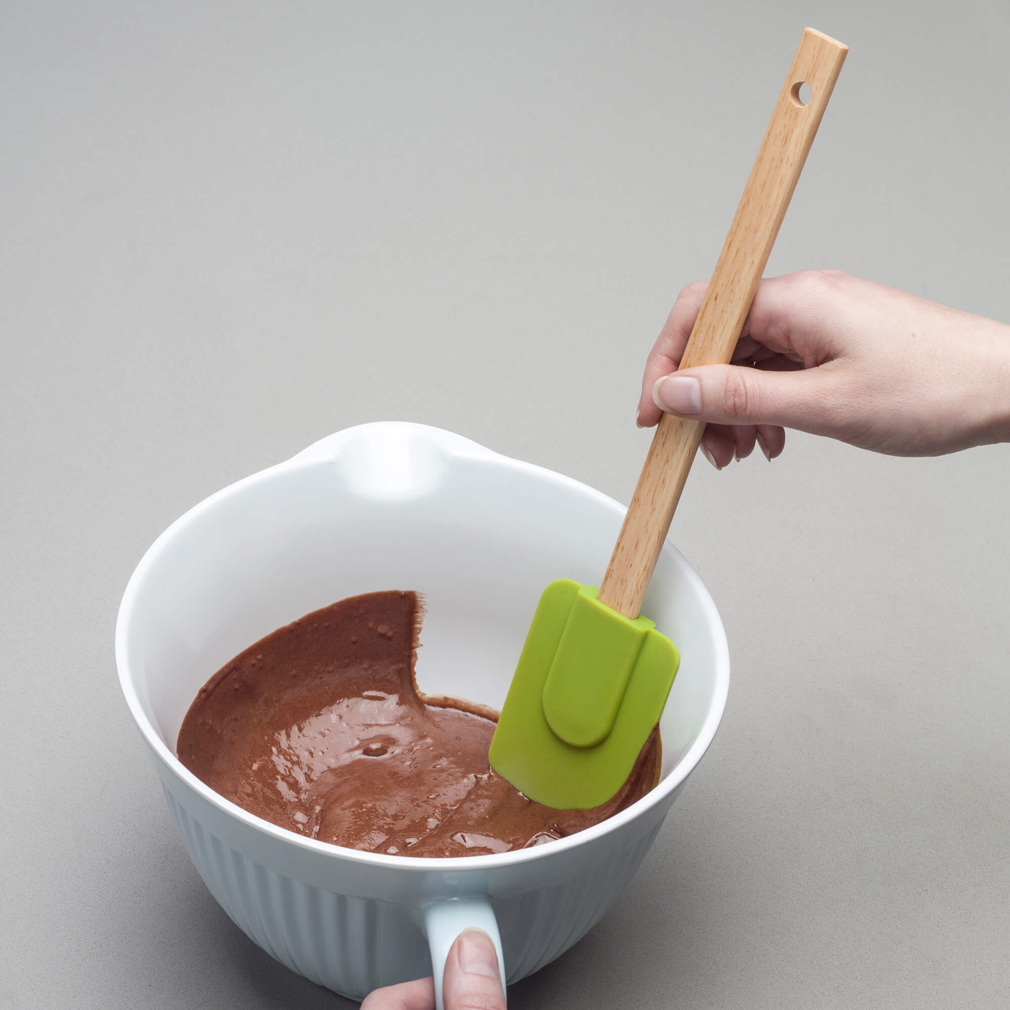 Using a Zeal Silicone Spatula to scrape a bowl