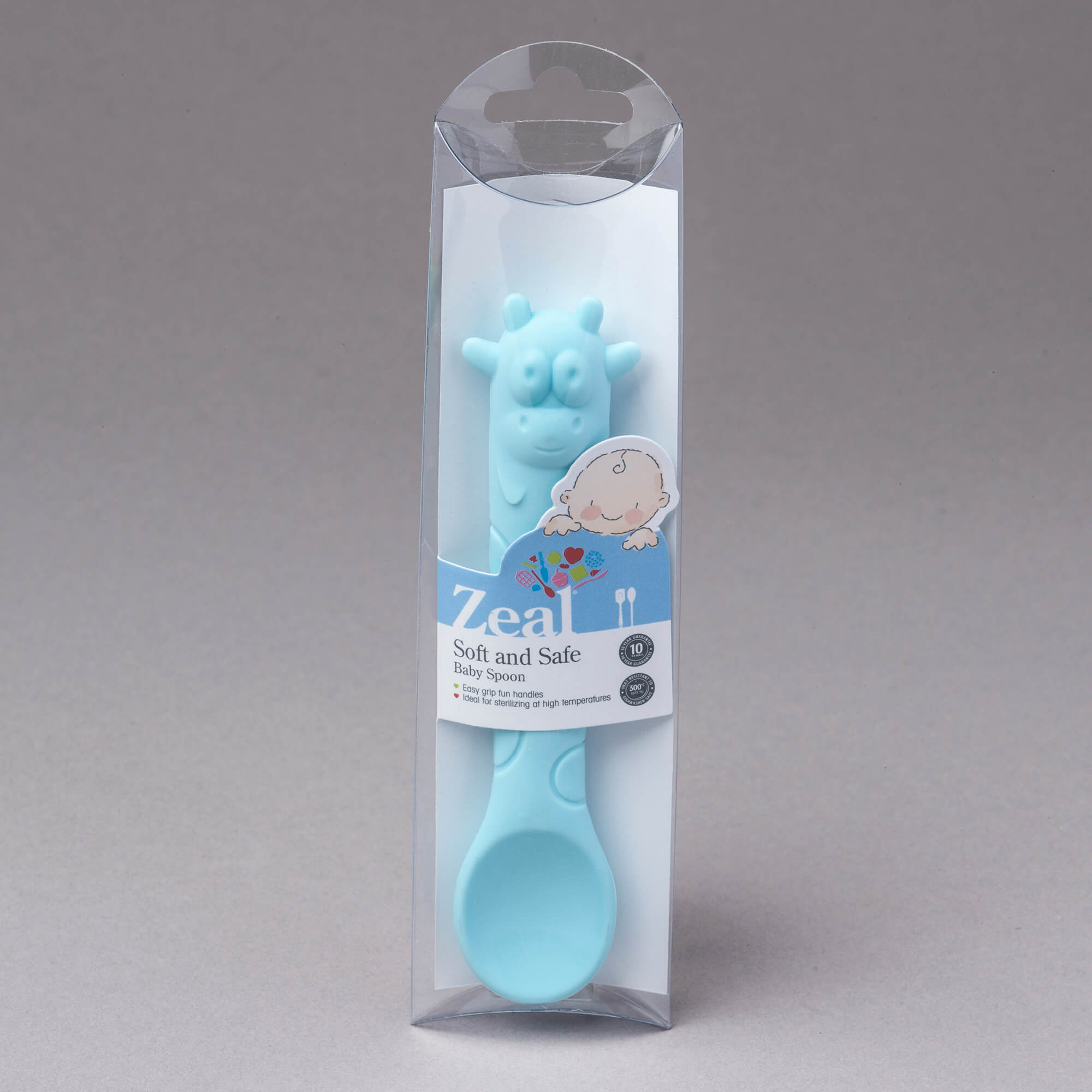 Zeal Silicone Cow Baby Spoon in packaging