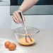 Using a Zeal Silicone Large Sauce Whisk to whisk eggs