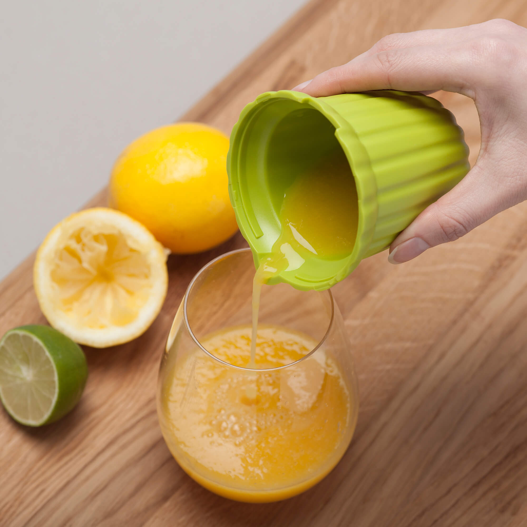 Pouring freshly squeezed juice from a Zeal Citrus Juicer