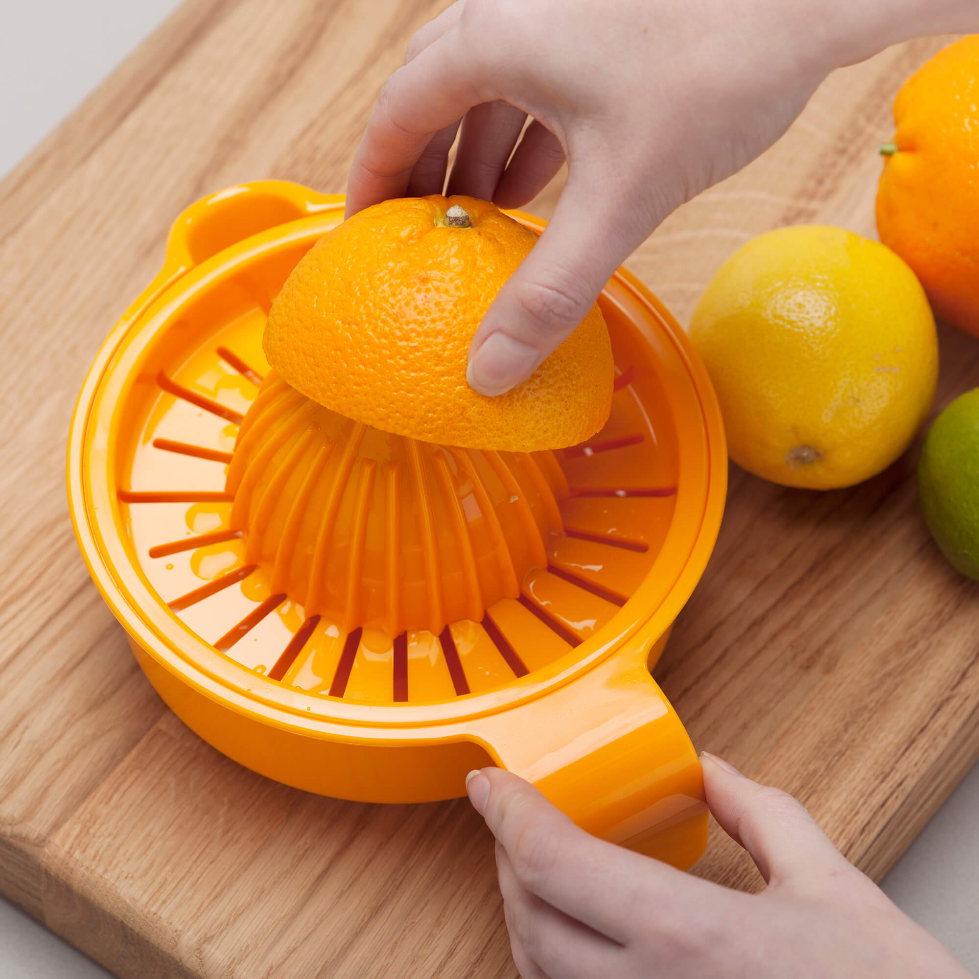 Zeal Easy Squeeze Juice Extractor squeezing oranges