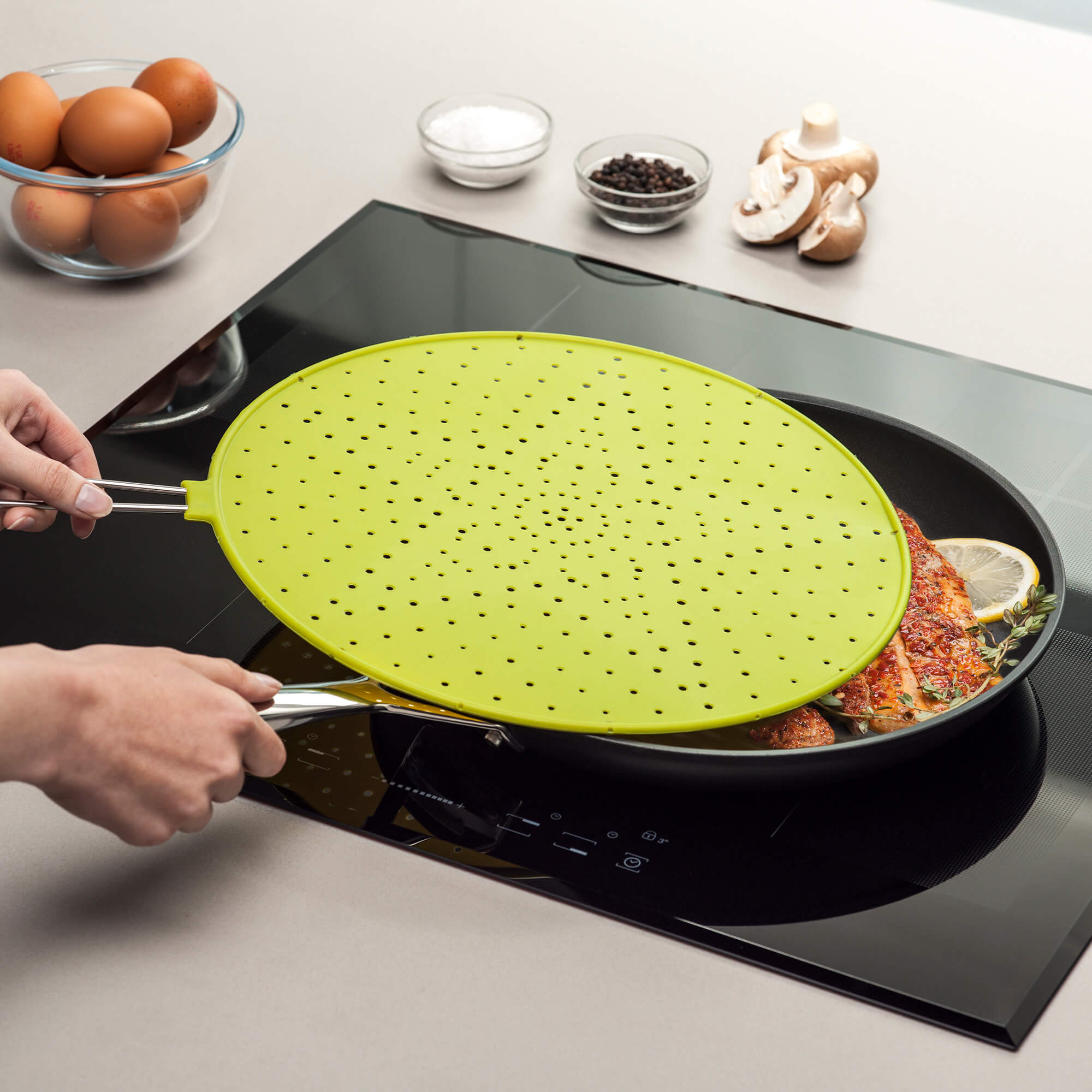 Zeal Lime No Splash Silicone Splatter Guard in use when cooking