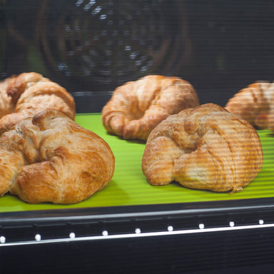 Zeal Non Stick Silicone Baking Sheet with freshly baked croissants in the oven
